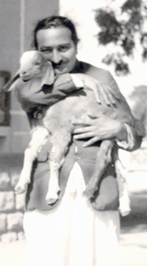 1939 February 8, holding Nubian goat in Alwar village, Rajasthan