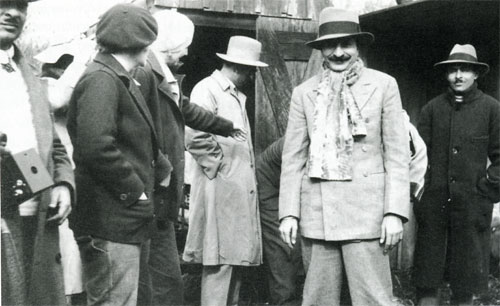 Meher Baba and several others standing about